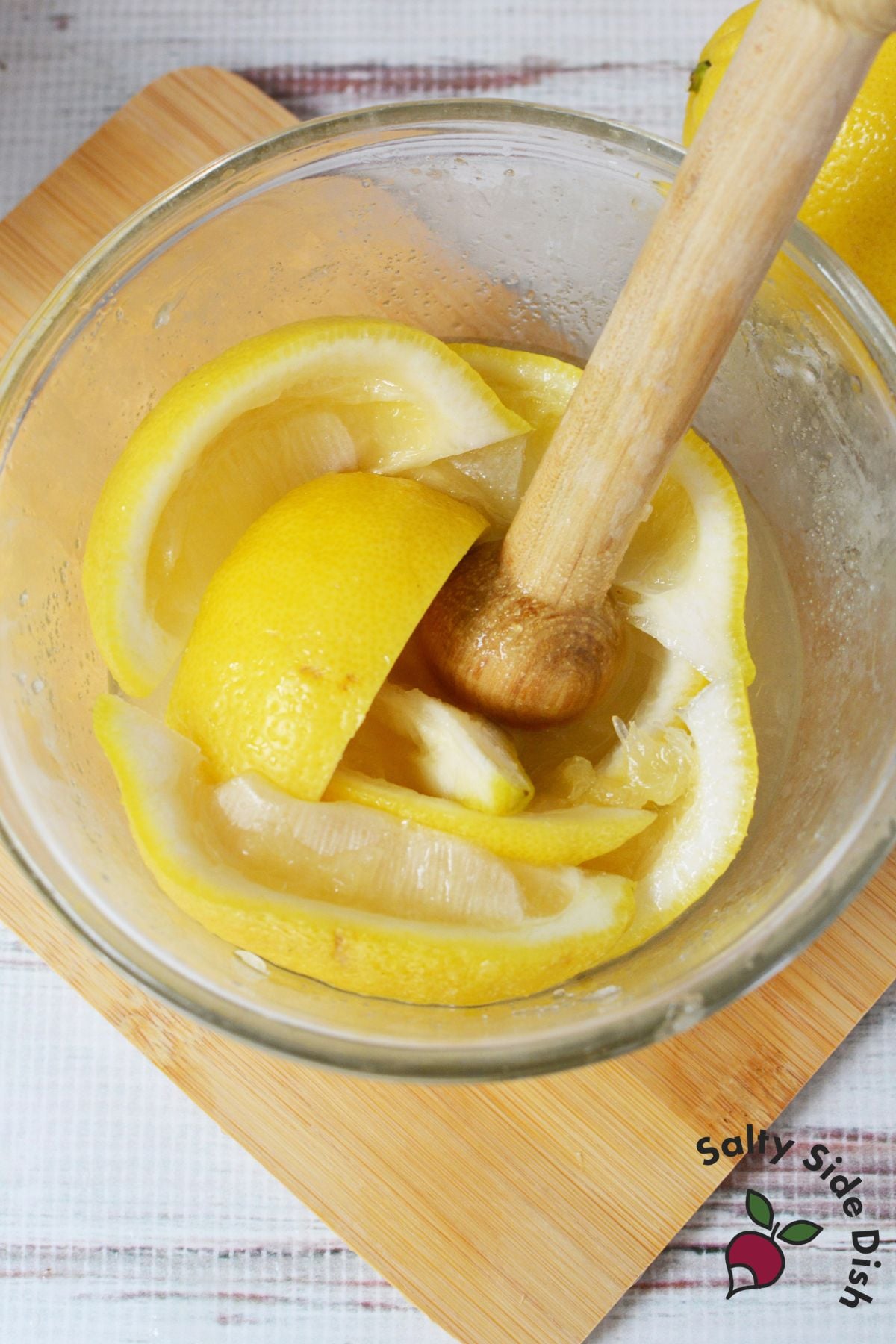 Glass of strawberry lemonade shake up garnished with lemon and strawberry