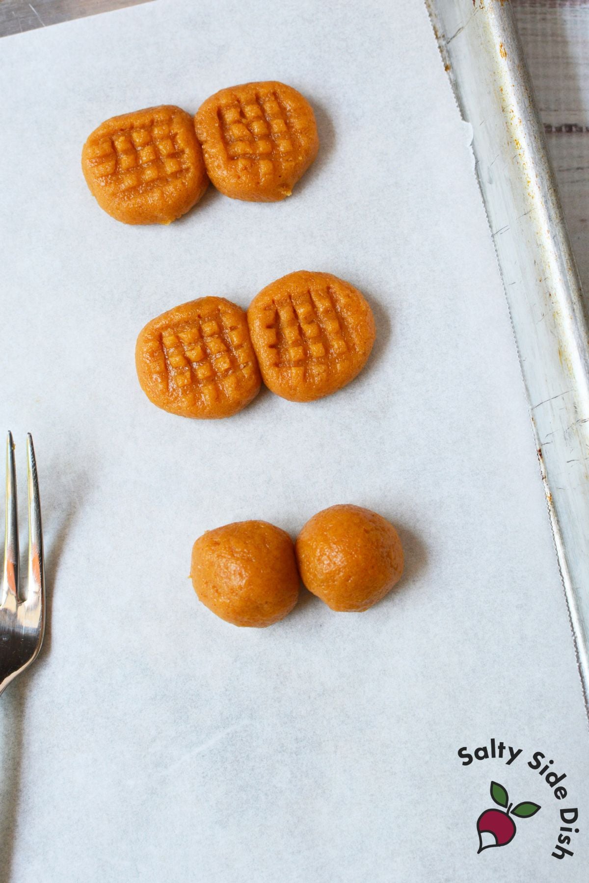 Nutter butter cookie dough shown in stages, from rolled balls to fork pressed crosshatch cookies