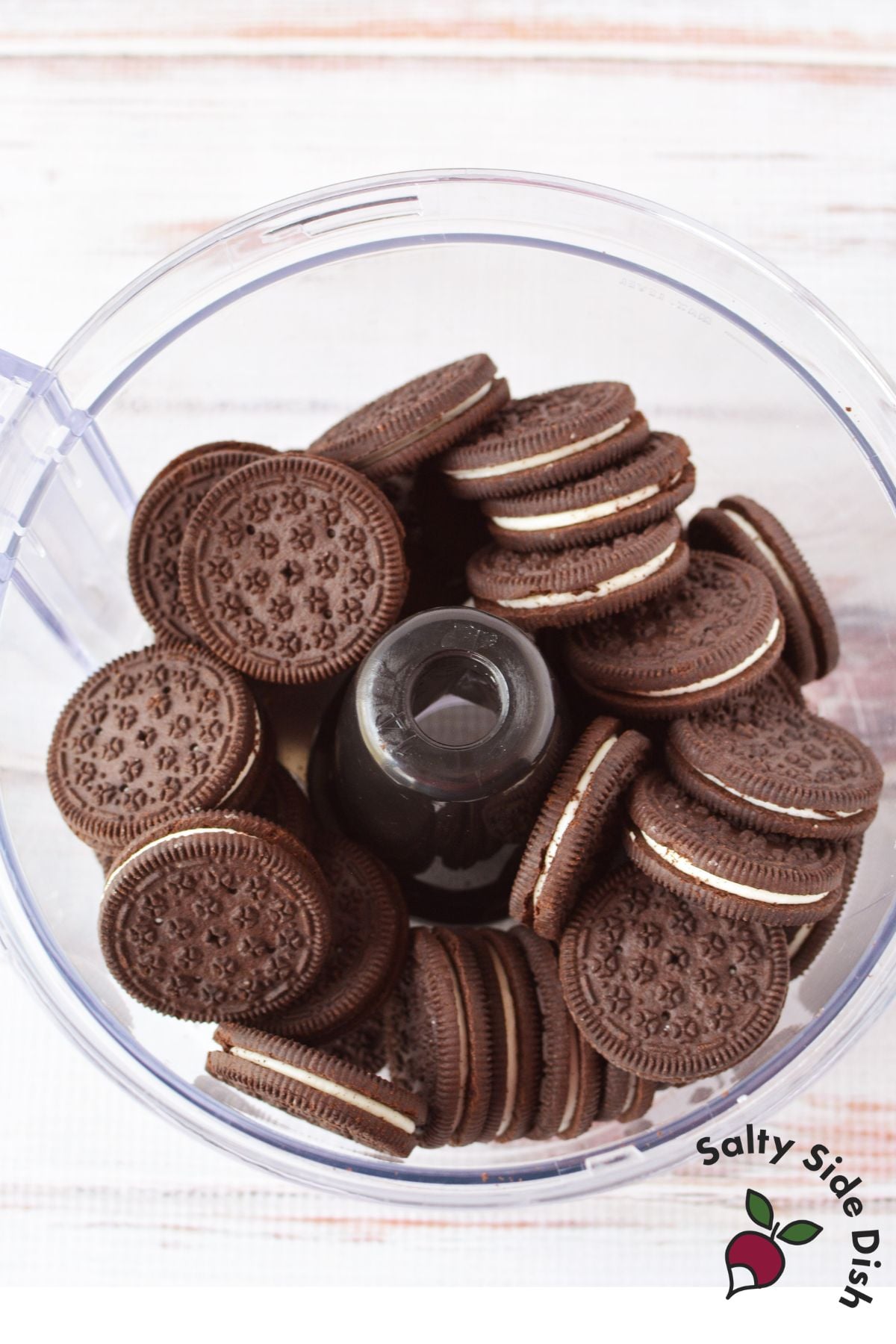 Oreo cookies in a food processor before being crushed into fine crumbs for Spring Oreo Truffles.