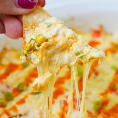 Crab rangoon dip mixed together in a casserole dish before baking