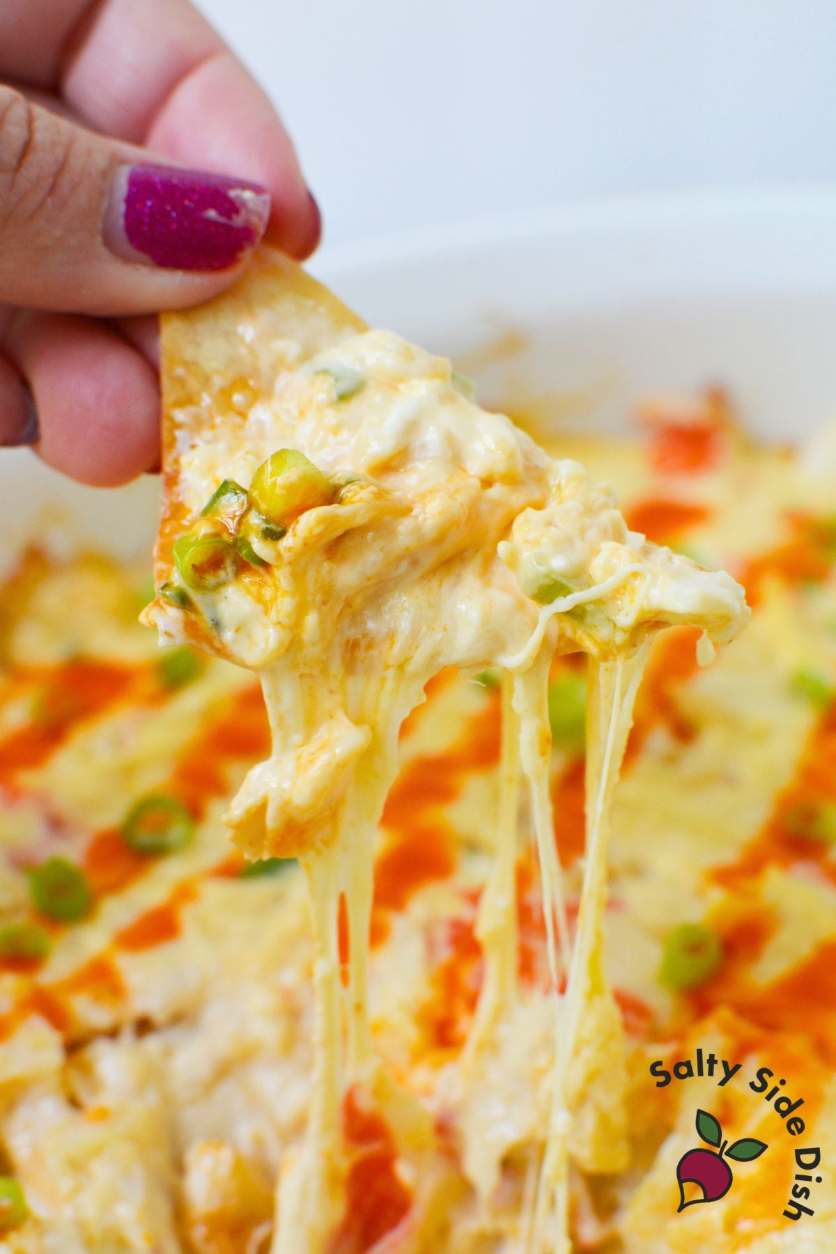 Crab rangoon dip mixed together in a casserole dish before baking