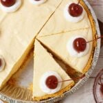 Overhead view of root beer float pie sliced and topped with cherries