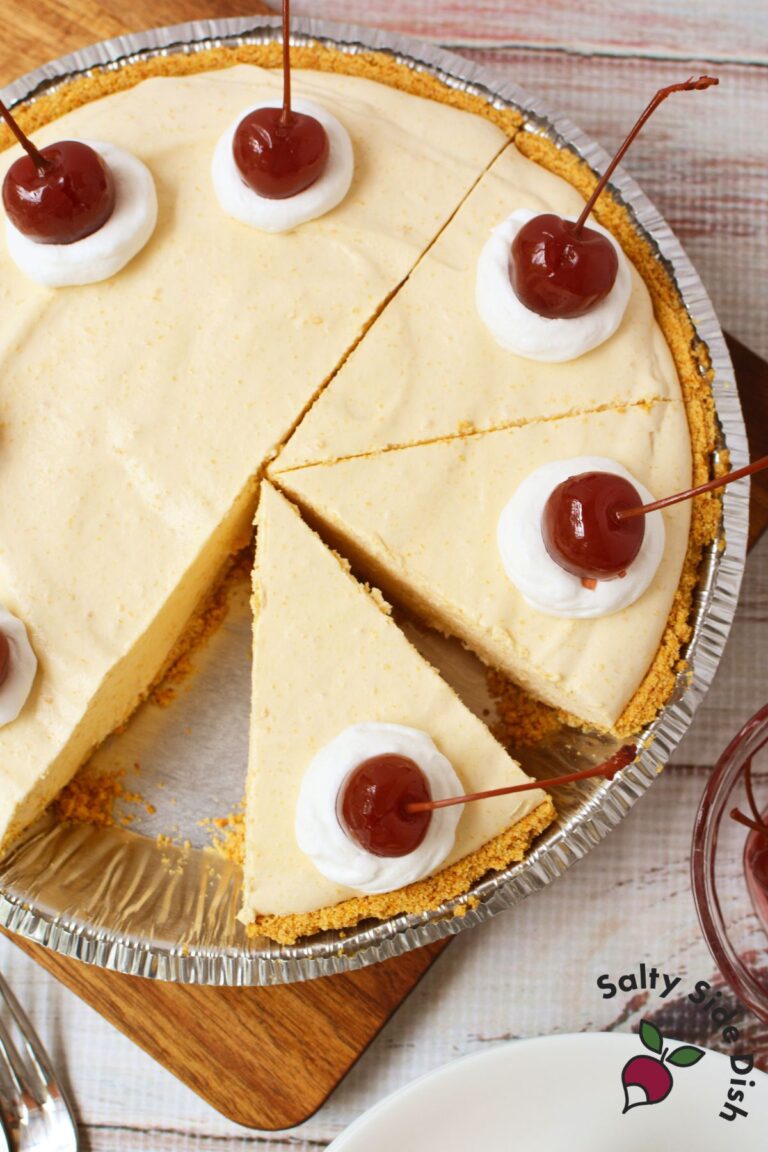 Overhead view of root beer float pie sliced and topped with cherries