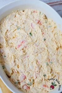 Crab dip ingredients including cream cheese, mayonnaise, and shredded cheese