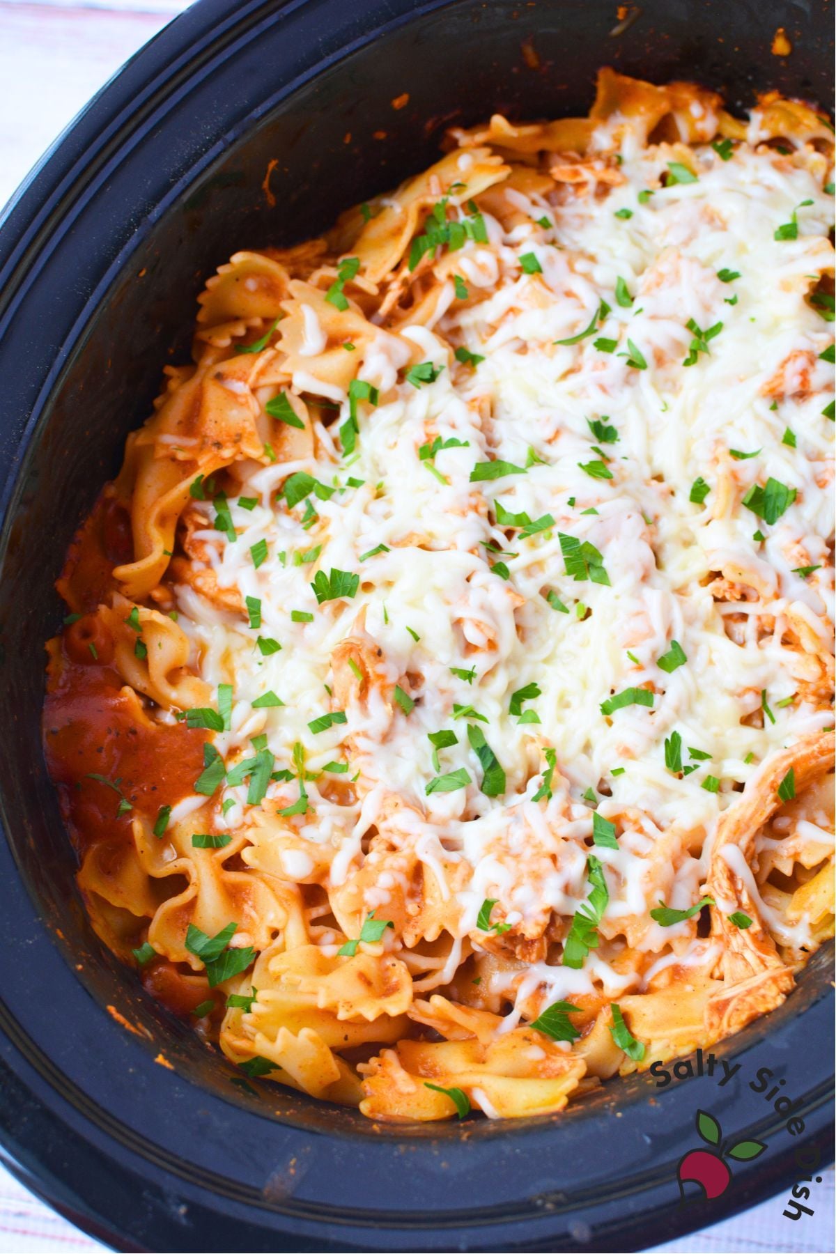 Slow cooker pink sauce pasta with chicken, farfalle, and melted mozzarella
