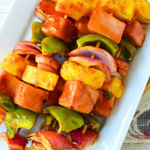 Grilled ham and pineapple kabobs with glazed ham, pineapple, peppers and red onio