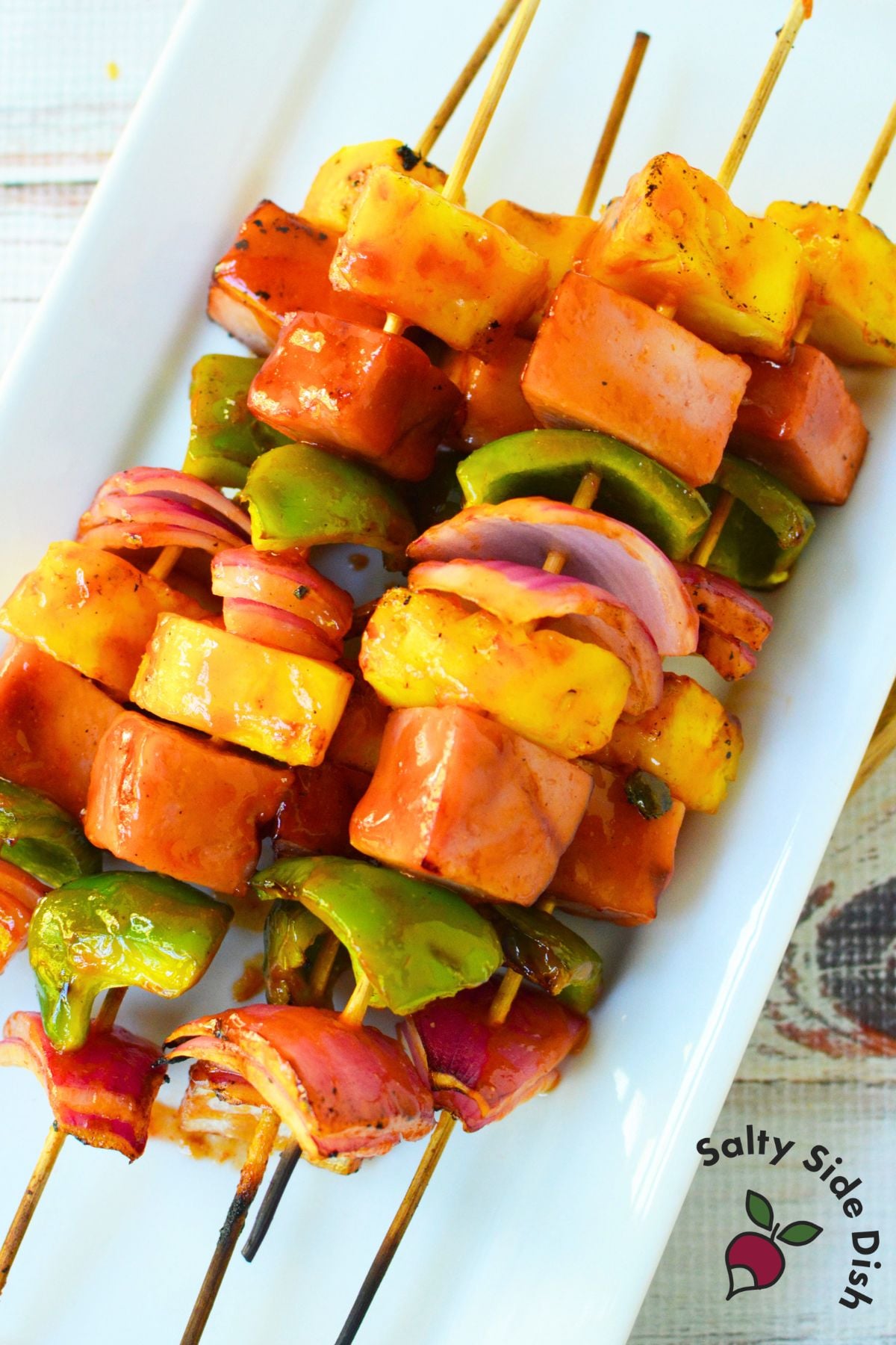 Grilled ham and pineapple kabobs with glazed ham, pineapple, peppers and red onion