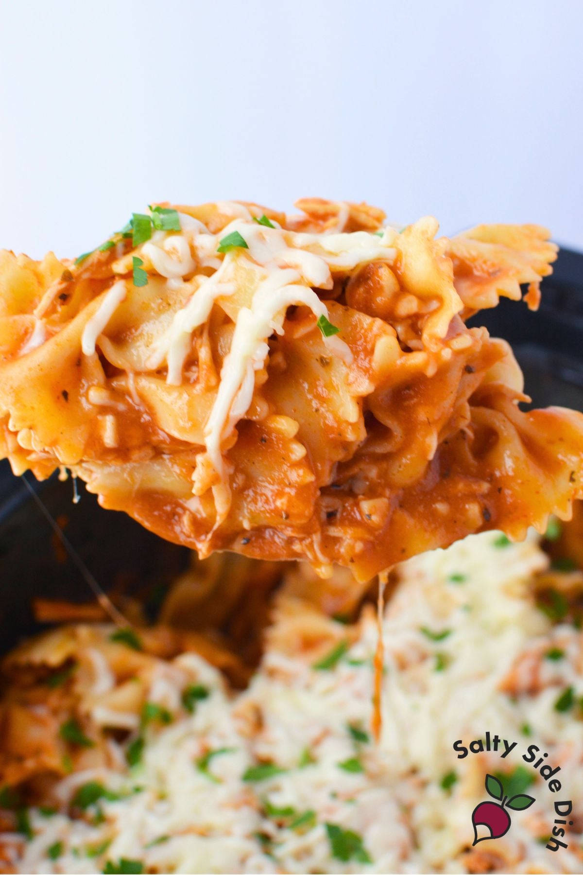 Creamy pink sauce chicken pasta with farfalle and melted cheese