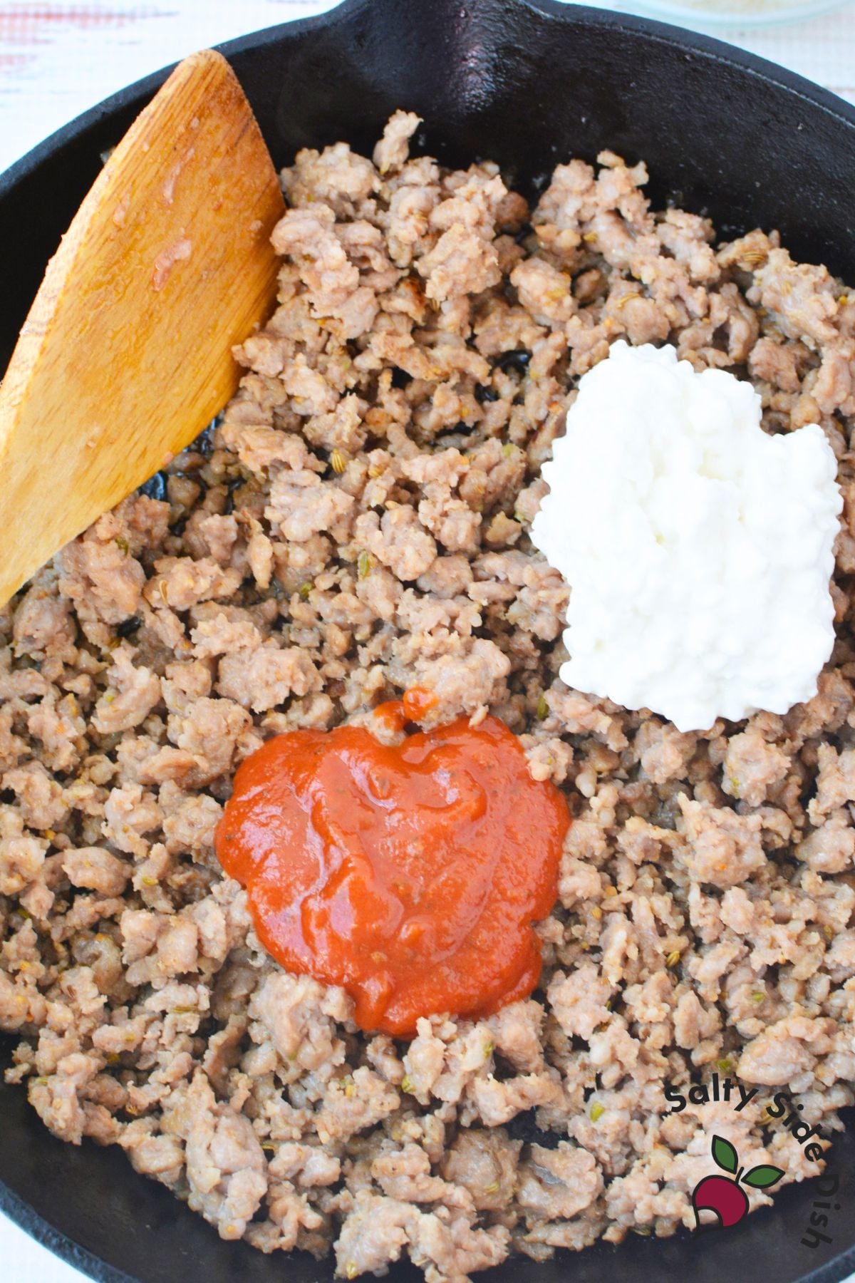 sausage, sauce, and cottage cheese in a skillet