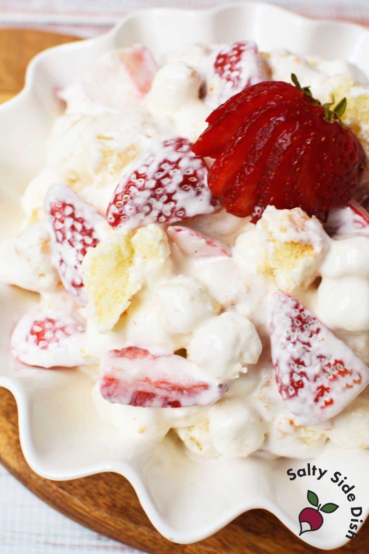 Close-up of strawberry shortcake fluff salad with fresh strawberries, pound cake, and mini marshmallows