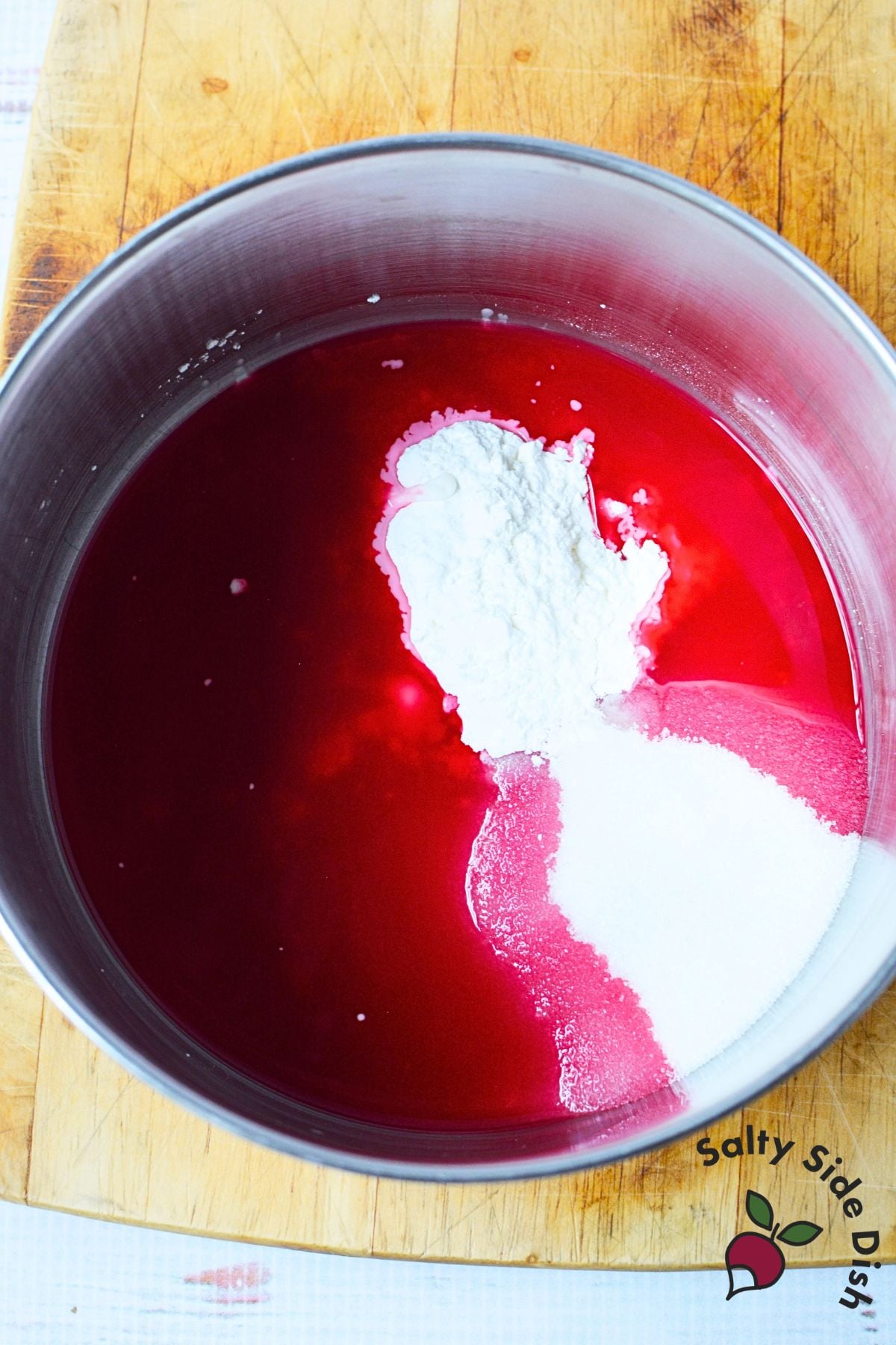 Beet juice with sugar and cornstarch in a saucepan for Harvard beets