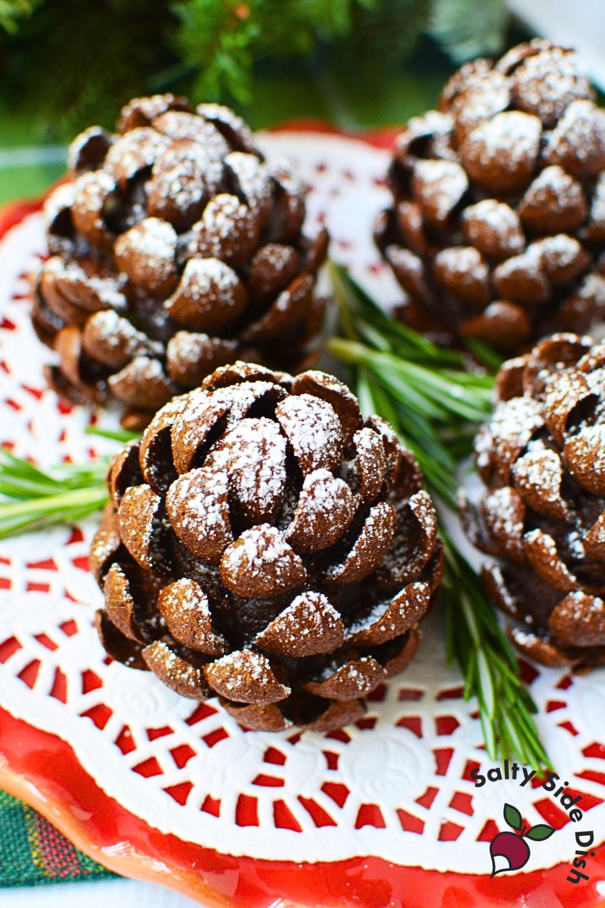Ingredients for pinecone brownies including chocolate chunks, butter, sugar, cocoa, flour, sweetened condensed milk, eggs, and Chocapic cereal.