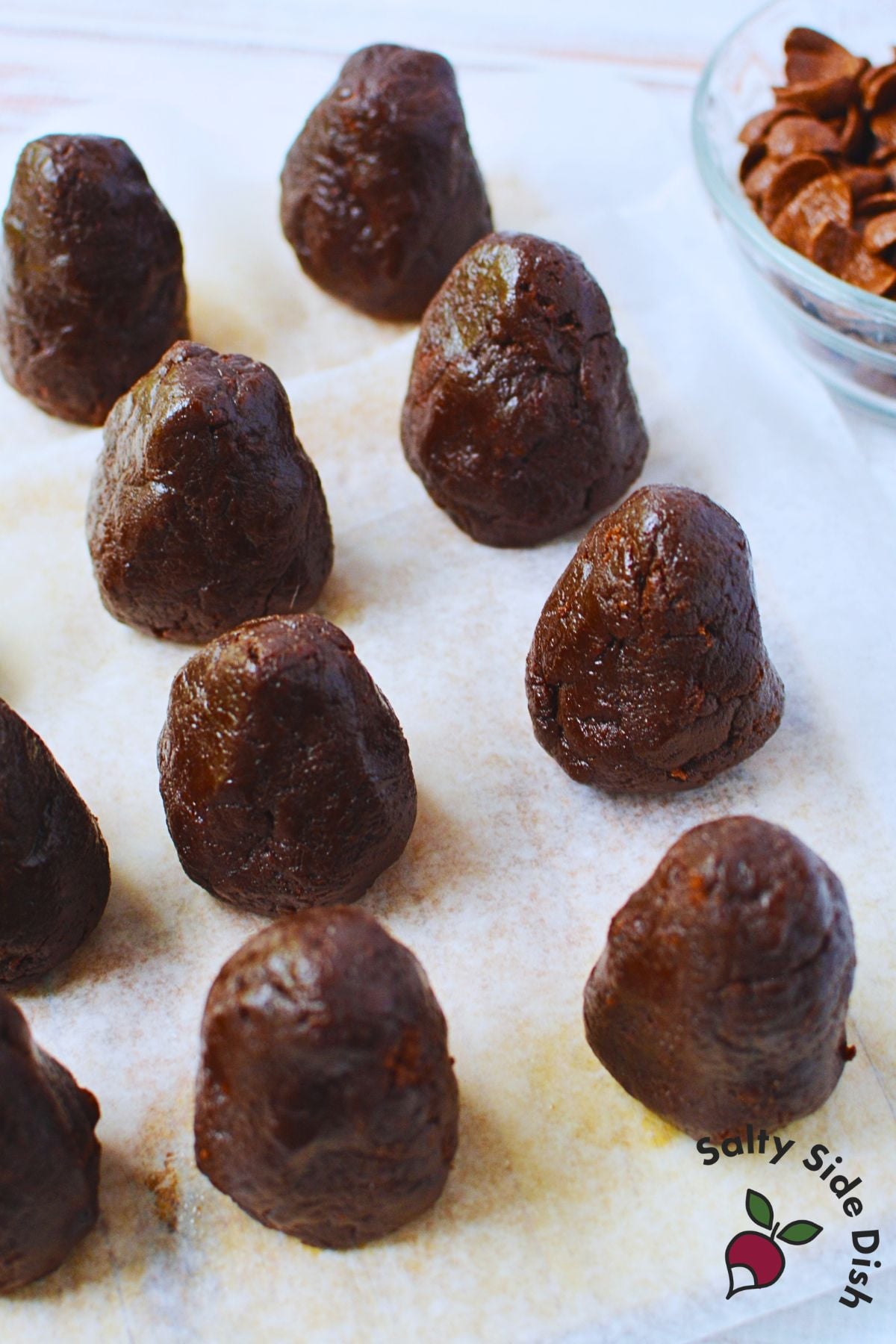Brownie mixture shaped into egg-size pinecone forms before adding the chocolate cereal.