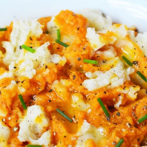 Thanksgiving pumpkin mashed potatoes with savory pumpkin, olive oil, chives, and cracked black pepper