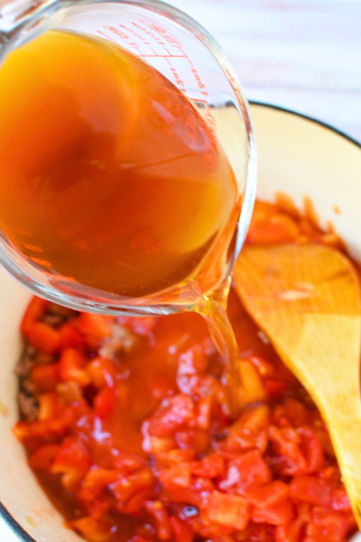Stuffed pepper soup has all the familiar flavors of homemade stuffed bell peppers, but everything cooks together in one big pot. It's loaded with ground beef, tender bell peppers, tomatoes, and white rice in a rich, savory broth. No stuffing or baking peppers required! Even if traditional stuffed peppers aren't your favorite, I think you'll really enjoy this soup! The texture is completely different, but you still get those hearty, comforting flavors that make this such a good fall dinner. I shared some with a friend, and she thought it was delicious, too! This recipe makes a big batch, so there's plenty for dinner with leftovers for another day.
