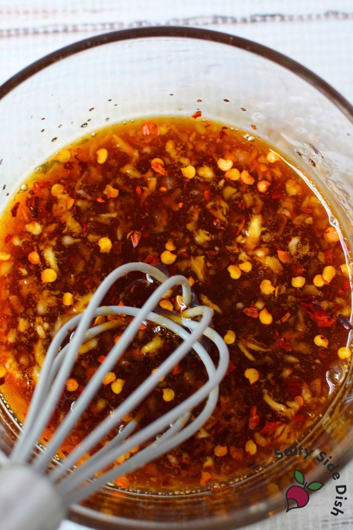 Honey, soy sauce, garlic, and crushed red pepper flakes whisked together for the green bean sauce.